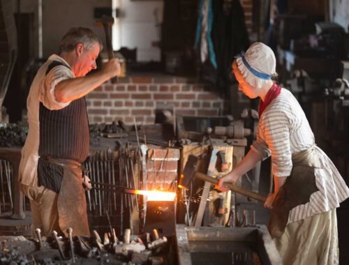 A person and person working in a workshop AI-generated content may be incorrect.